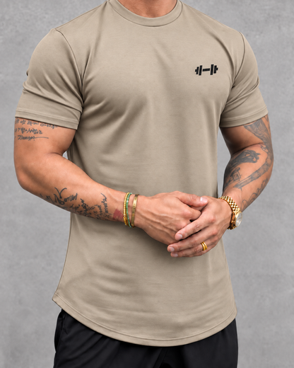 The Sweat District Performance Tee — Khaki front, collar-level crop. AI garment visualization; material specifications unverified.