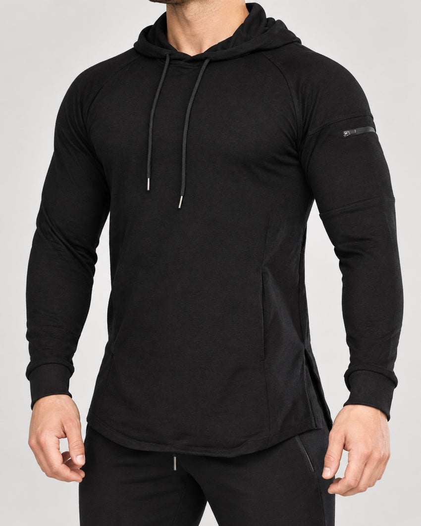 Bounty Sleeve-Pocket Hoodie in Black — front studio view showing the sleeve zip pocket and curved hem.