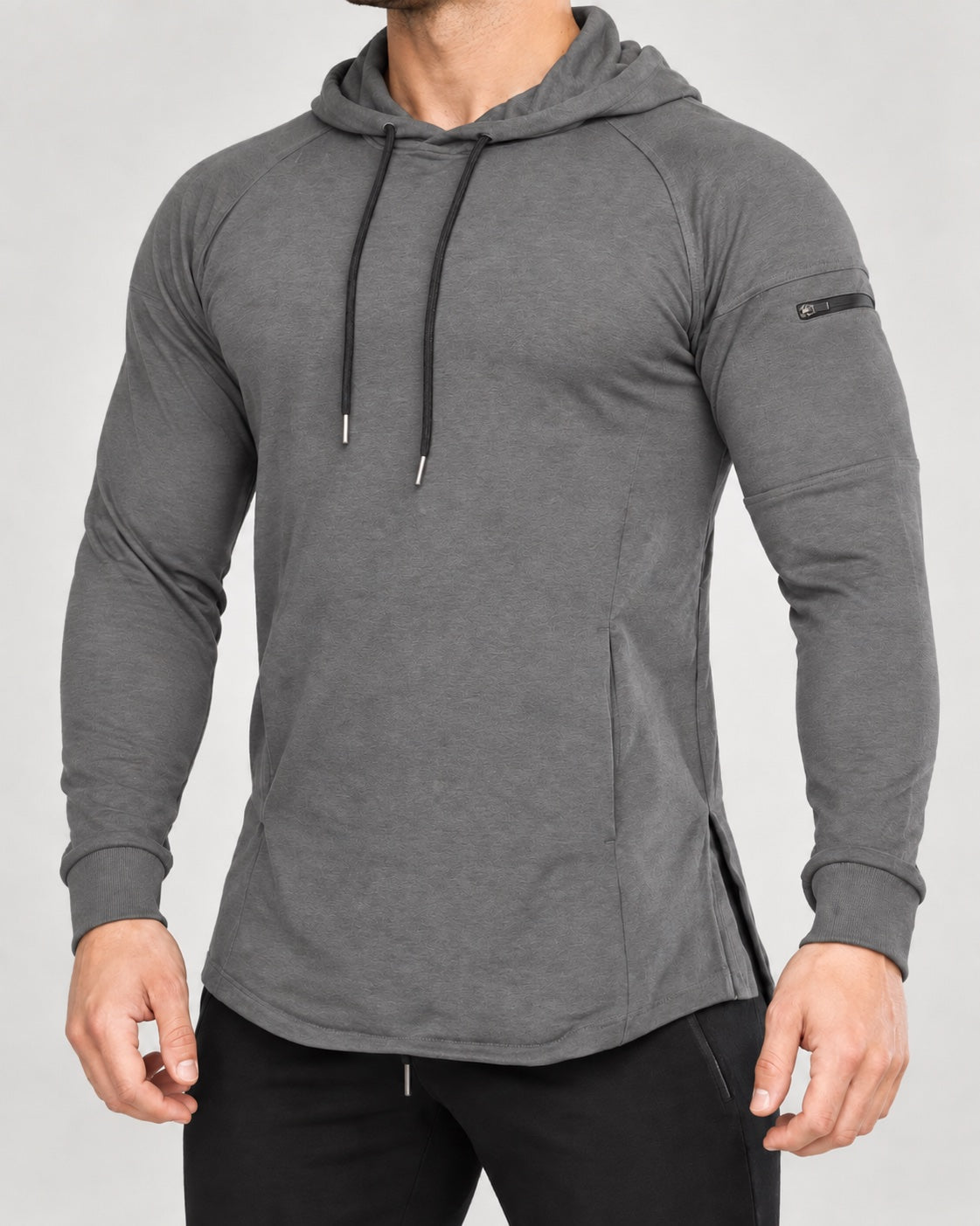 Bounty Sleeve-Pocket Hoodie in Gray — front studio view showing the sleeve zip pocket and curved hem.