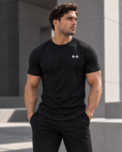 Black Form Muscle Tee, closer three-quarter fit view with the curved hem visible.