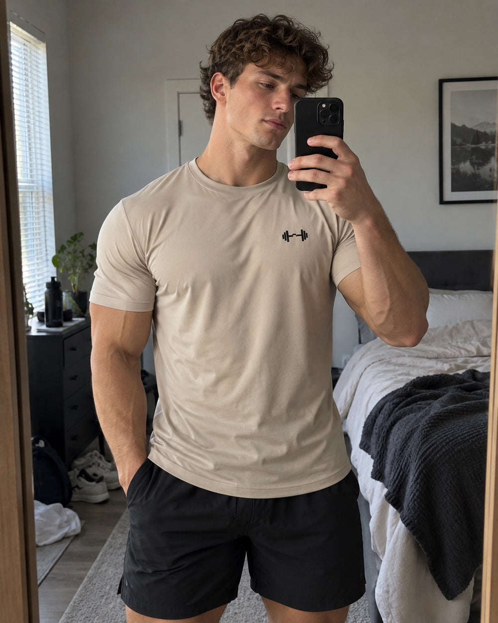Stone tee in a bedroom. The Sweat District styling image.