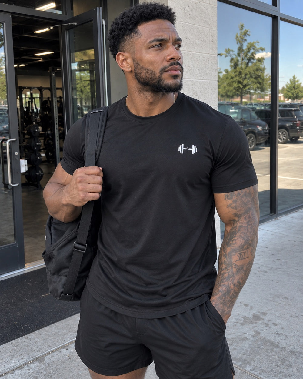 Black tee outside the gym. The Sweat District styling image.