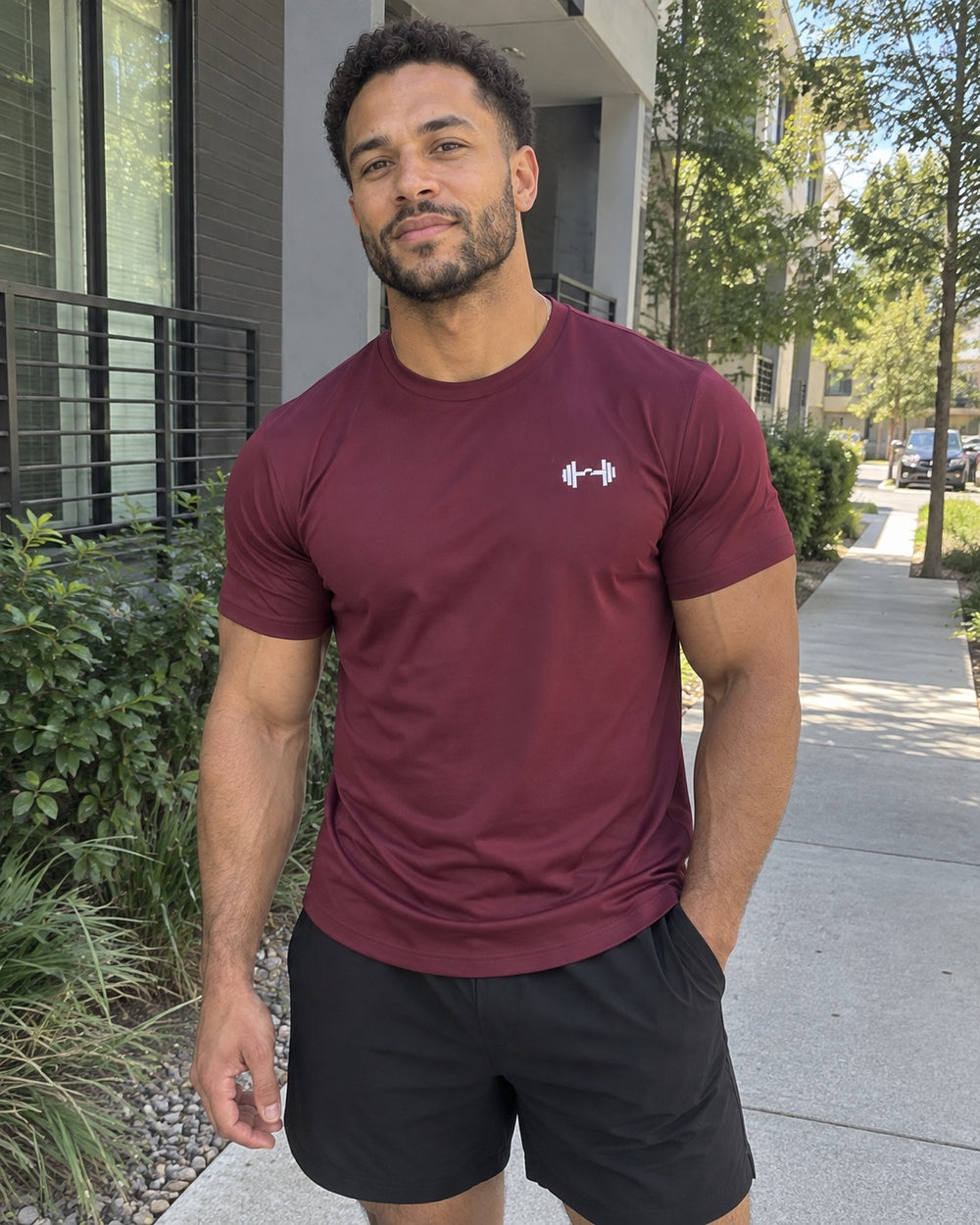 Burgundy tee outdoors. The Sweat District styling image.